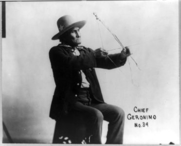 Geronimo, Apache Chief, 1829-1909, three-quarter length portrait, seated with drawn bow LCCN2005688150