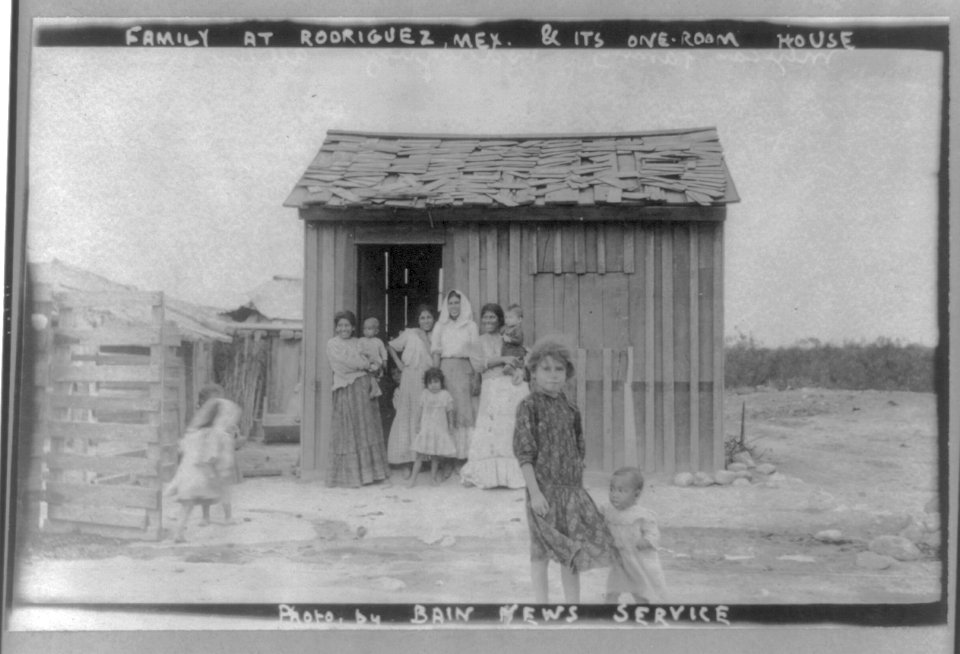 Eleven women and children outside one-room home, Rodriguez, Mexico LCCN2016648998