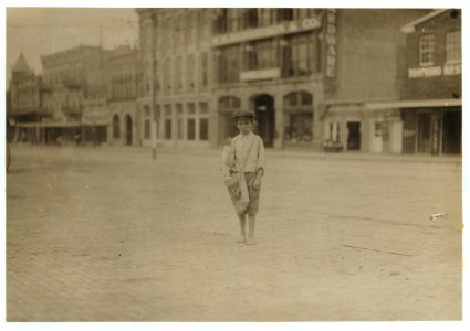 Eleven year old newsie who has been selling for three years. He gets up at 2-30 A.M. Sundays, and at 5-00 A.M. school days. Makes about $1.25 a day. Norval Sharp. Photo taken early Sunday LOC nclc.03883