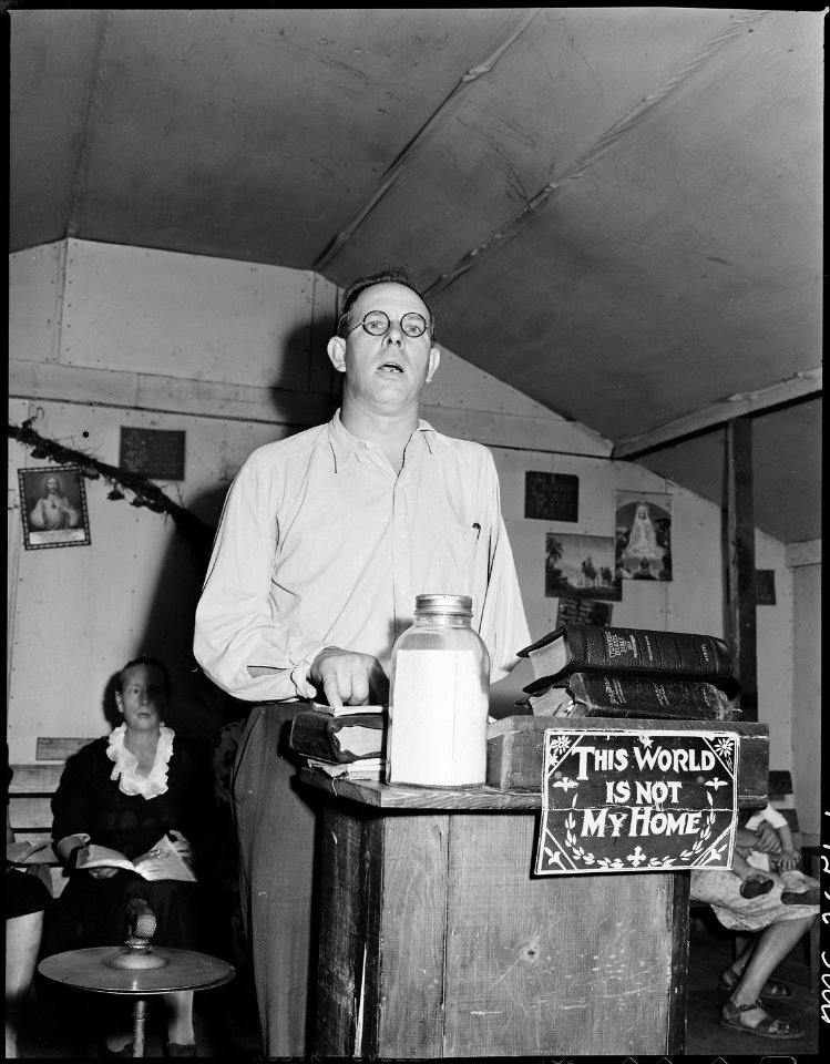 Eli Sanders, pastor at the Pentecostal Church of God, he is a tipple worker and track loader at P V & K Coal Company... - NARA - 541346