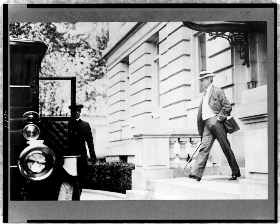 Elihu Root, walking toward automobile and chauffeur LCCN97513837