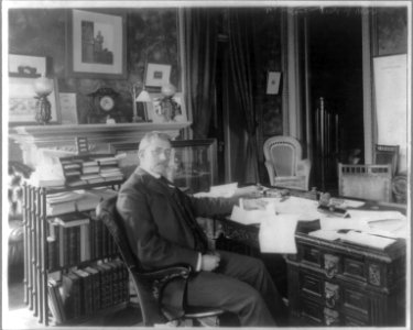 Elihu Root, 1845-1937, three-quarter length portrait, seated at desk, facing left LCCN2005689592