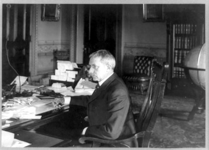 Elihu Root, half-length portrait, seated at desk, facing left LCCN89709886 photo