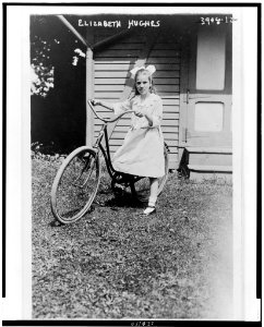 Elizabeth Hughes, full-length portrait, standing, facing front, holding bicycle LCCN98507204