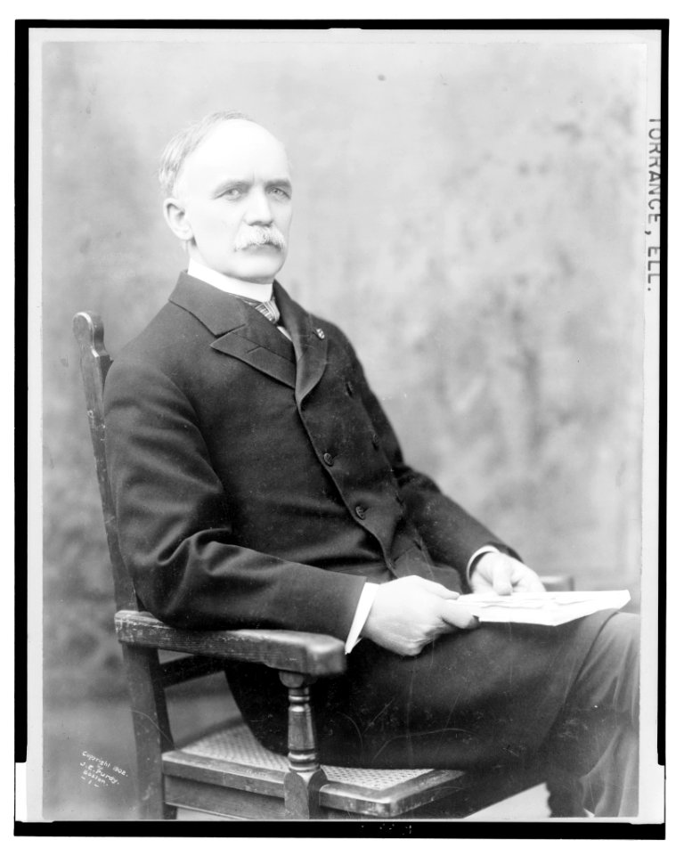 Ell. Torrance, three-quarter length studio portrait, seated, facing slightly right LCCN2004676648