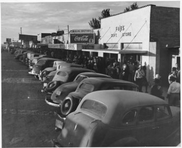 Eloy, Pinal County, Arizona. Crowds of cotton pickers on main street of Eloy late Saturday afternoon. - NARA - 522057