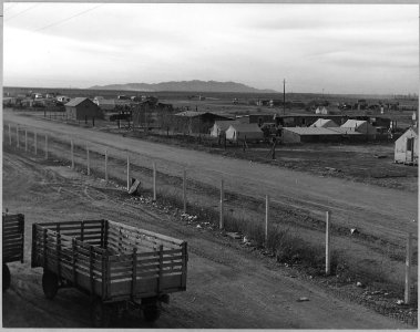 Eloy, Pinal County, Arizona. Squatter camp, across the road from the cotton gin. The only water avai . . . - NARA - 522272 photo