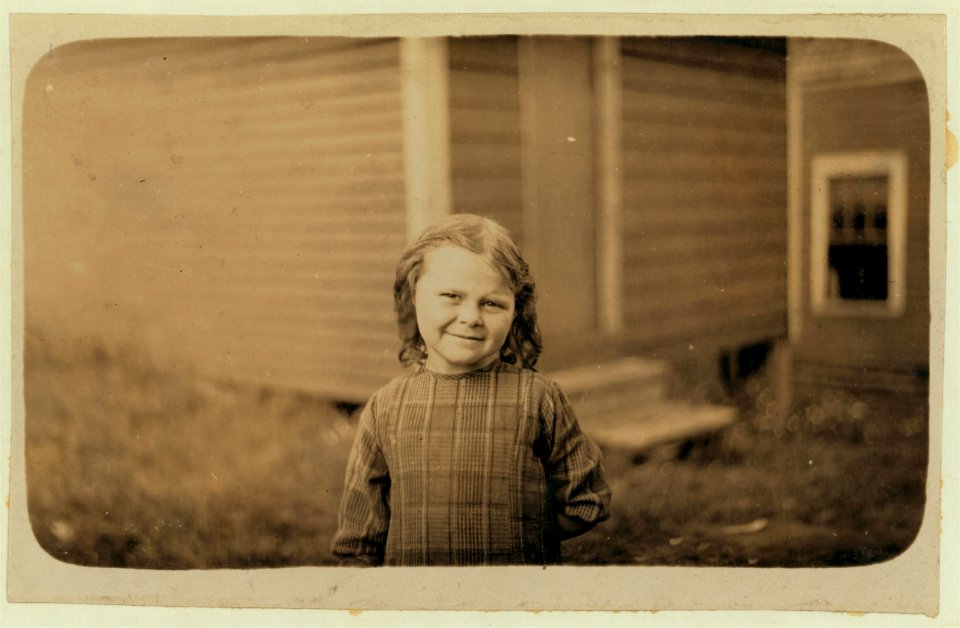 Elsie Shaw, a 6 year old cartoner in the summer, Seacoast Canning Co., Factory -2. Her father is boss of cutting room in Factory -1. He asked me to take some photos of her, as he has her do LOC nclc.00931