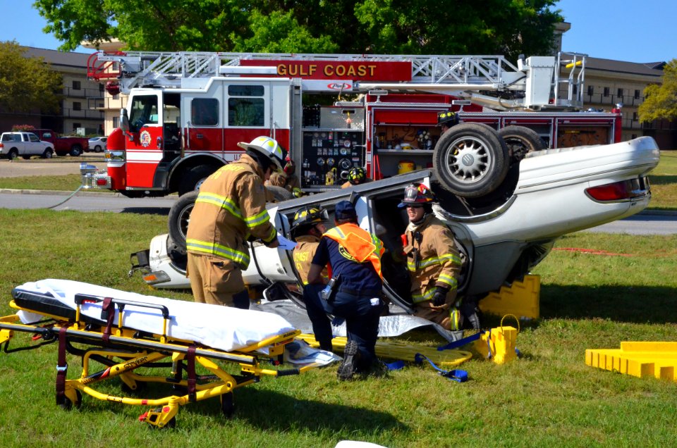 Emergency service personnel remove one of the simulated casualties from a motor vehicle accident