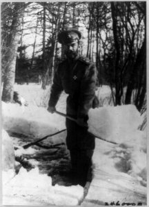 Emperor Nicholas II shovelling snow in the park at Tsarskoe Selo, Russia, where he and the royal family were interned, 1917 LCCN2004674571