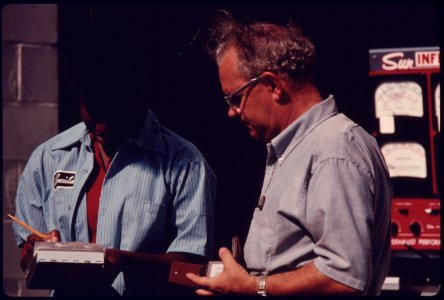 Employee at the Hamilton County Auto Emission Inspection Station at Newtown, Ohio...08-1975 (4266519054)