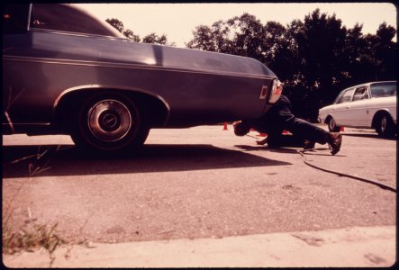 Employee at the Hamilton County Auto Emission Inspection Station at Newtown, Ohio...08-1975 (4266519818)