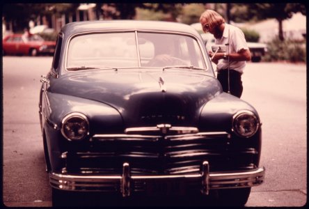 Employee at an Auto Emission Inspection Station in Downtown Cincinnati, Ohio...08-1975 (4266532768)