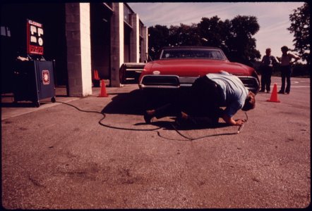 Employee at the Hamilton County Auto Emission Inspection Station at Newtown, Ohio...08-1975 (4266520182)