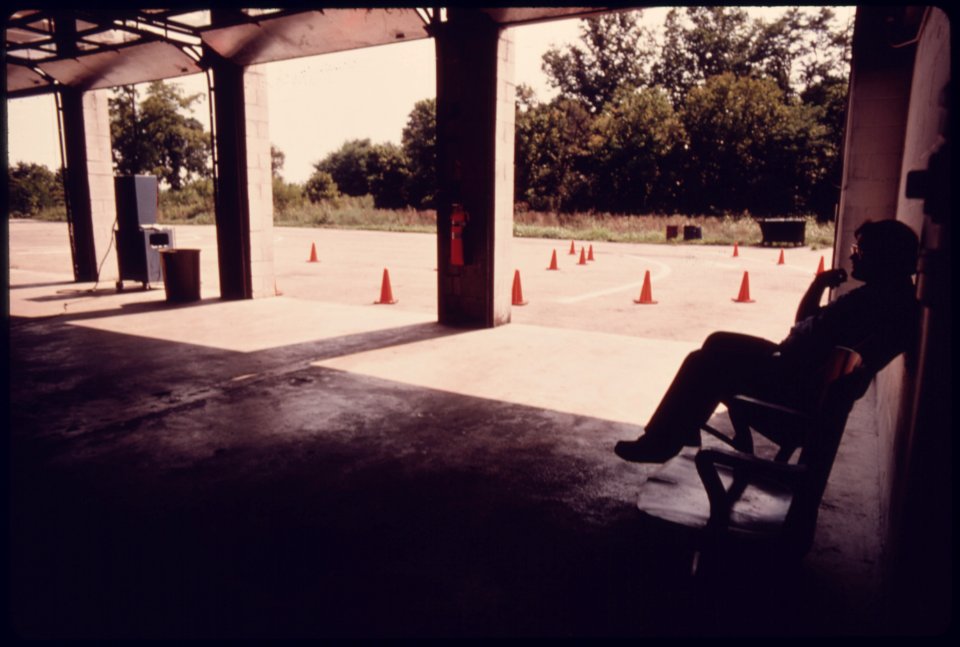 Employee Waiting for Business at the Hamilton County Auto Emission Inspection Station at Newtown, Ohio...08-1975 (4266517502)