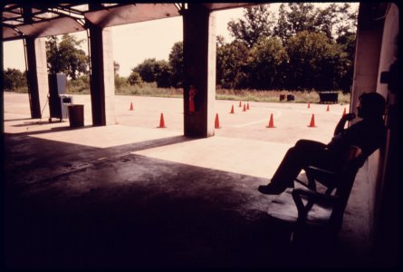 Employee Waiting for Business at the Hamilton County Auto Emission Inspection Station at Newtown, Ohio...08-1975 (4266517502)