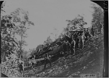 Engine - thrown over embankment, showing manner of raising it to the track. - NARA - 525176