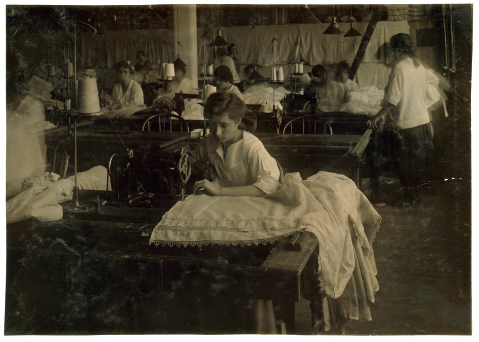 Gertrude Belier, 15 years old. Hemming curtains on machine at Boutwell, Fairclough & Gold, 274 Summer Street Extension. Mr. Fitzgerald, Manager. LOC nclc.05191