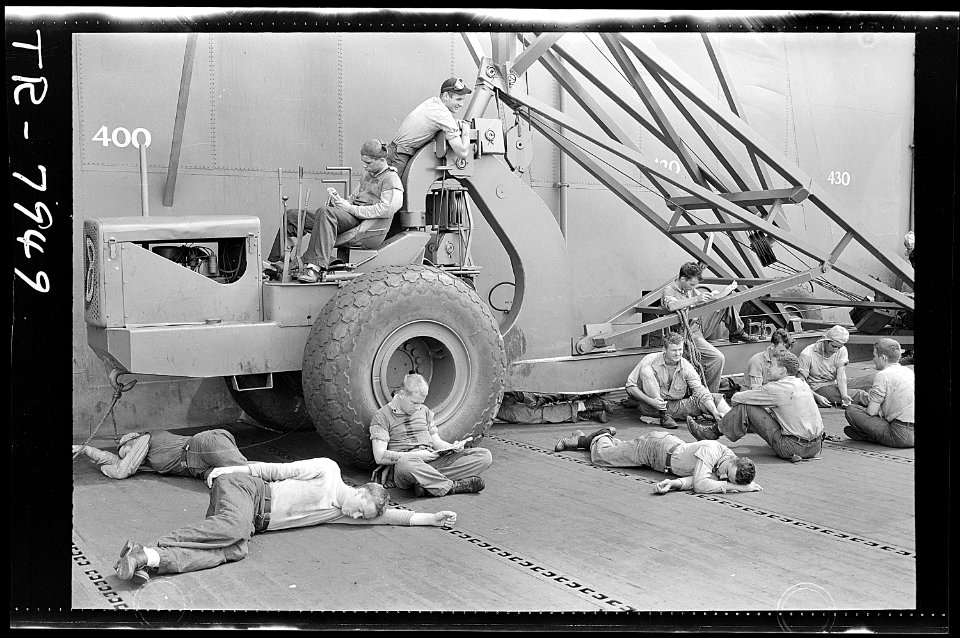 Enlisted men relaxing on flight deck of the USS Lexington (CV-16). - NARA - 520904