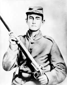 Enoch Hooper Cook, Jr., Pvt, Co. H. 38th Alabama Infantry, C.S.A., half-length portrait, facing front holding rifle LCCN2005695743 (cropped)