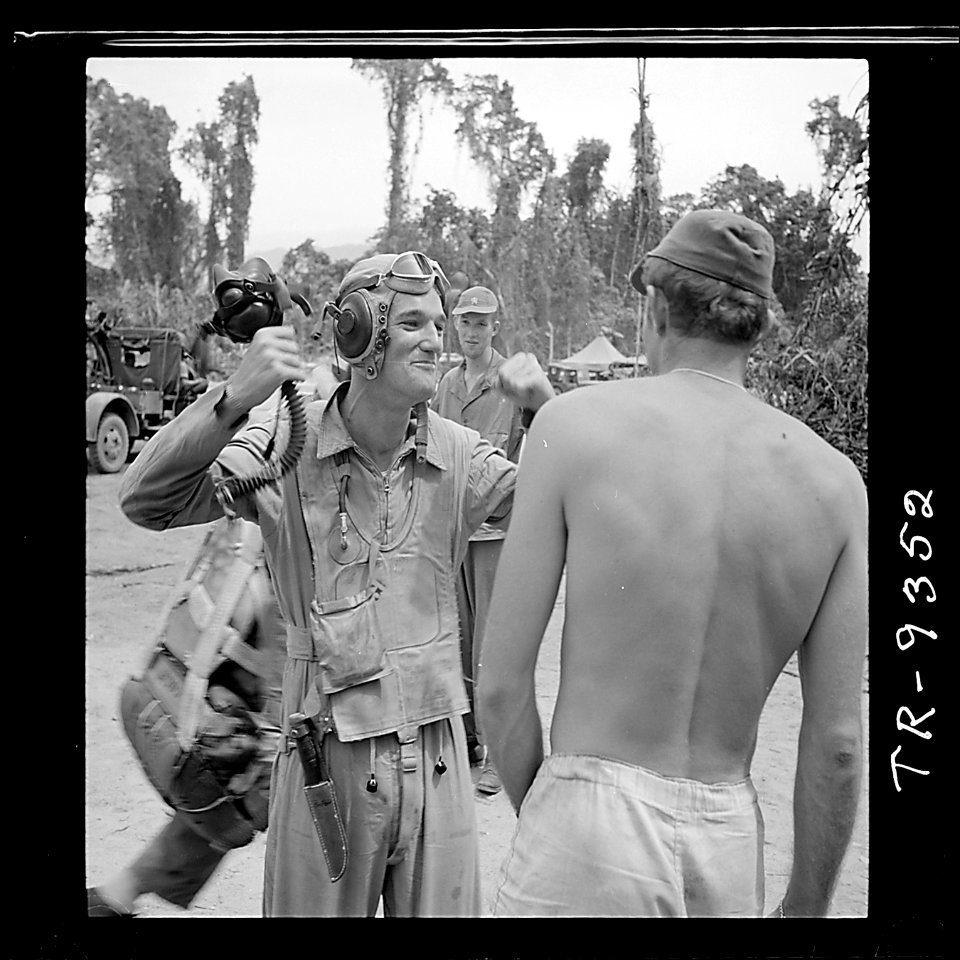 Ens. Andy Jagger of Southampton, N.Y., describes kill made over Rabaul to Lt. H.A. March of Washington, D.C., at... - NARA - 520959