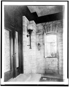 Entrance with etched glass door at left, sconce, and open window, in home of Edmund Cogswell Converse, Greenwich, Connecticut LCCN94503197