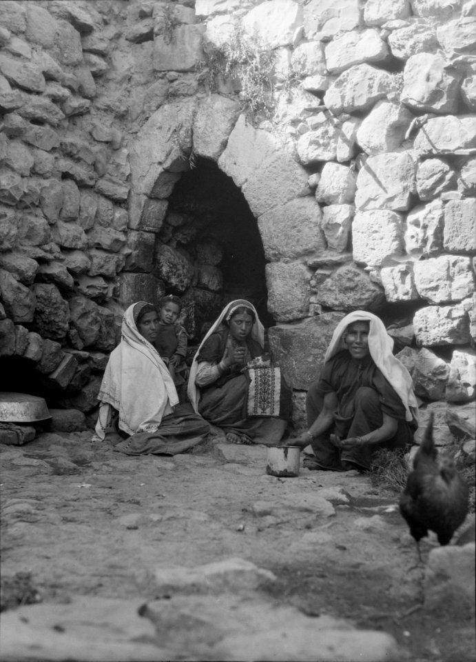 Environs of Jerusalem. El Kubeibeh. In the village. Peasant girls in a courtyard embroidering LOC matpc.15175