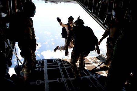 EOD technicians perform a free fall jump from a C-130 Hercules during a military free fall jump sustainment training in Santa Rita, Guam. (21600858854)