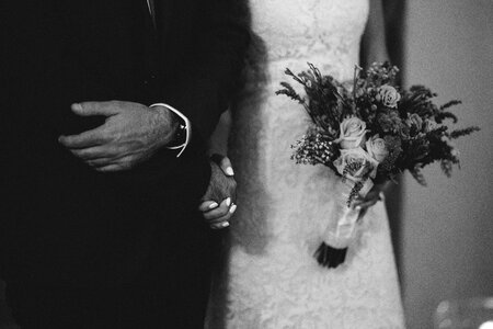 Groom bride holding hands photo