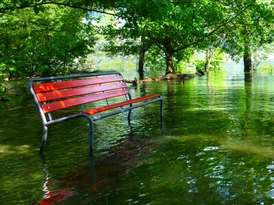 Red park bench high water lago maggiore photo