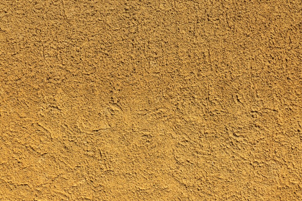 Scratch plaster textured plaster wall