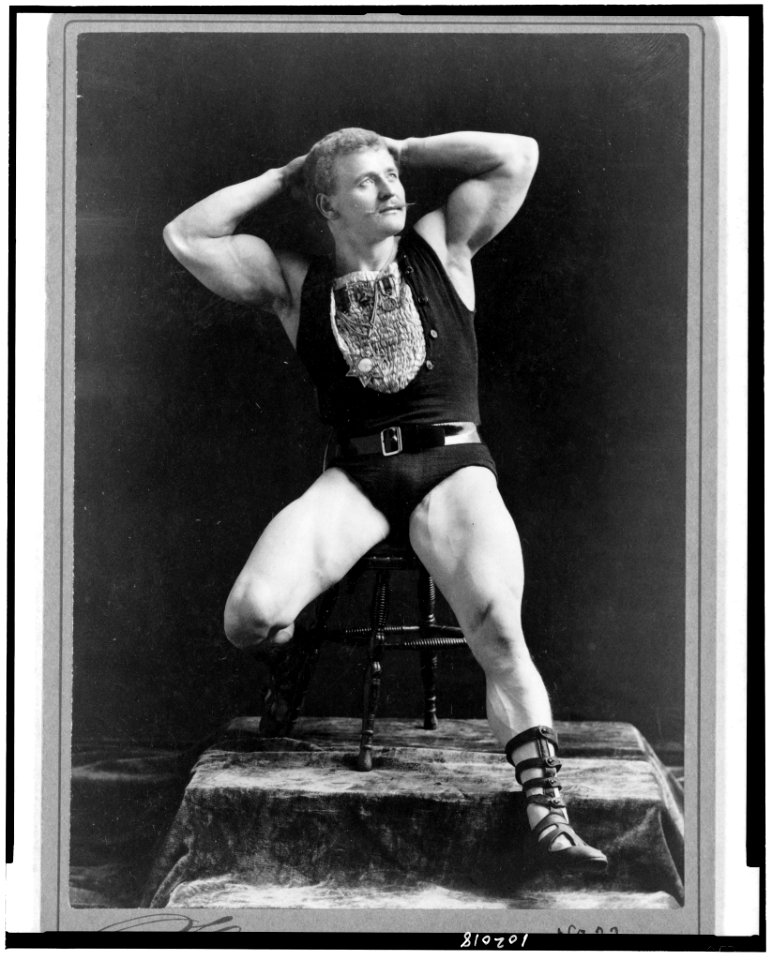 Eugen Sandow, full-length portrait, seated, facing right, hands behind head) - Sarony, 37 Union Sqr., N.Y LCCN90715341