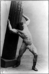 Eugene Sandow, 1867-1925, full length, standing, facing right, wearing fig leaf and holding pillar in Samsonesque posture LCCN2005686777