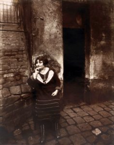 Eugène Atget - La Villette. Rue Asselin, prostitute waiting in front of her door - Google Art Project photo