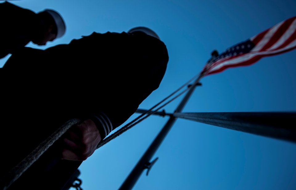Evening colors aboard future USS America 141007-N-LD343-003
