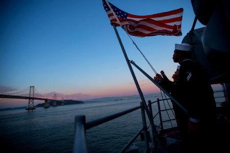 Evening colors aboard future USS America 141007-N-LD343-004