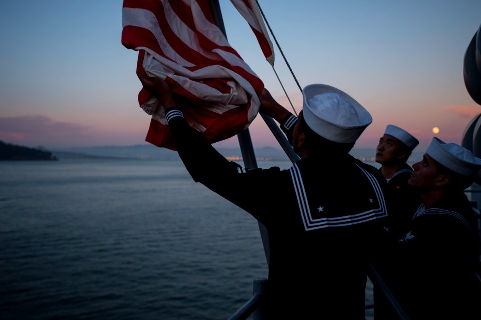 Evening colors aboard future USS America 141007-N-LD343-005