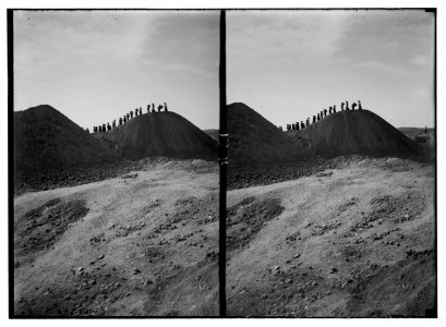 Excavations. Ain Shems (Beth Shemesh) on the Sharon Plain. Beth Shemesh excavations. The dumps. Line of basket women silhouetted against horizon LOC matpc.03005