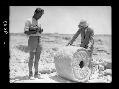 Excavations. Tell Beit Mirsim, (Kirjath Sepher). Excavators measuring an ancient dye vat, 1000 B.C. LOC matpc.15682