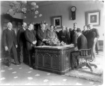 Exchange of the ratifications of the treaty of peace with Spain, made in the President's office, White House, Secretary of State John Hay signing LCCN2005688549
