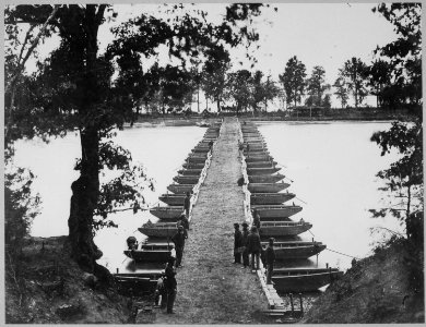Expedients for Crossing Streams. A pair of small pontoons, designed to facilitate scouting operations. A boat can be mad - NARA - 519419