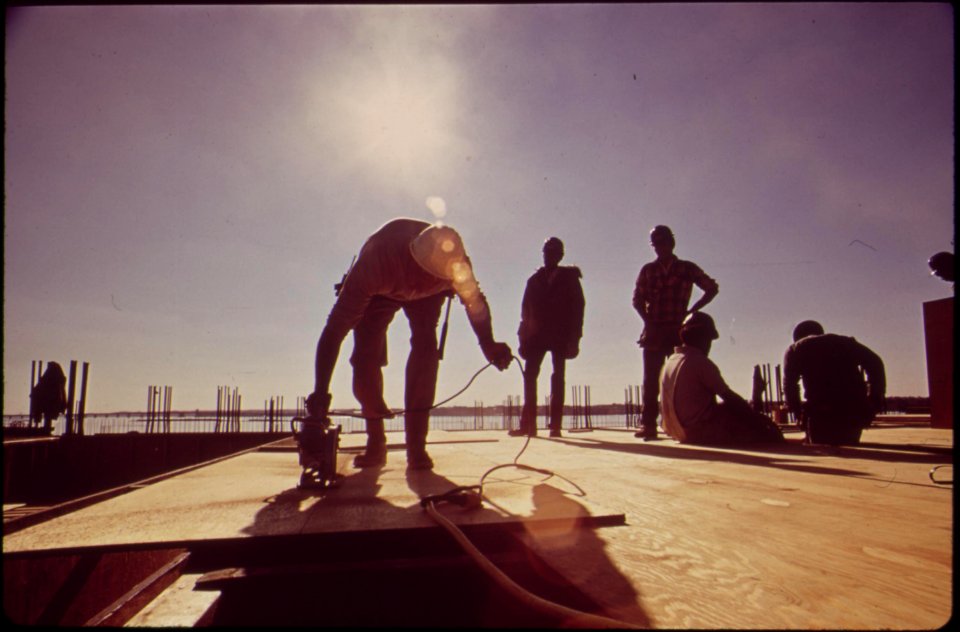 Expansion-of-the-blue-plains-sewage-treatment-plant-workmen-are-fitting-flooring-into-place-at-filtering-plant-november-1972 7461329444 o