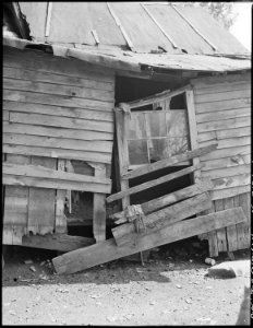 Exterior of three room house which rents for $4 monthly. This property, formerly owned by a coal mining company, is... - NARA - 541172 photo