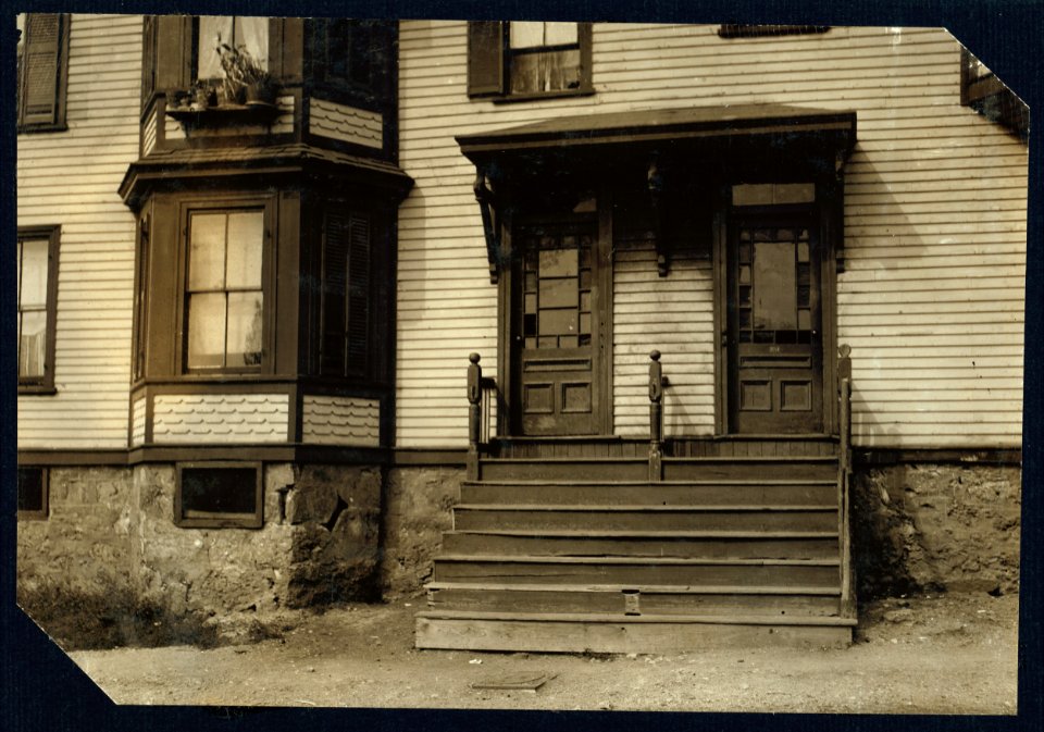 Exterior view of 251-253 Highland Street, Roxbury, Mass., where much home work is done. LOC nclc.04235