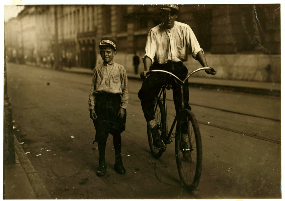 Extremes meet. One of the youngest and one of the older messenger boys in Mobile. The small boy is Emmet Brewster, Postal messenger -3. 11 years old; been working there 7 months. Makes $10 LOC nclc.03938