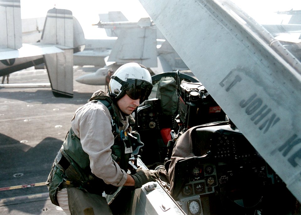 F-14 Pilot Climbing into Cockpit