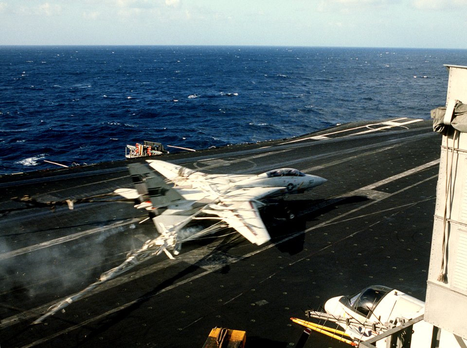 F-14A of VF-1 makes barrier landing on USS Kitty Hawk (CV-63) in 1984
