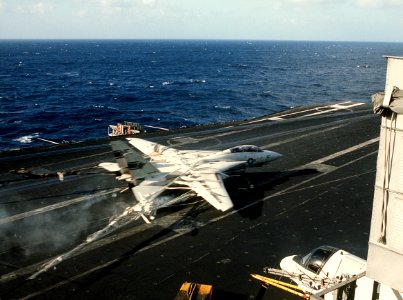 F-14A of VF-1 makes barrier landing on USS Kitty Hawk (CV-63) in 1984