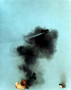 F-14A flies over QF-86F debris 1977