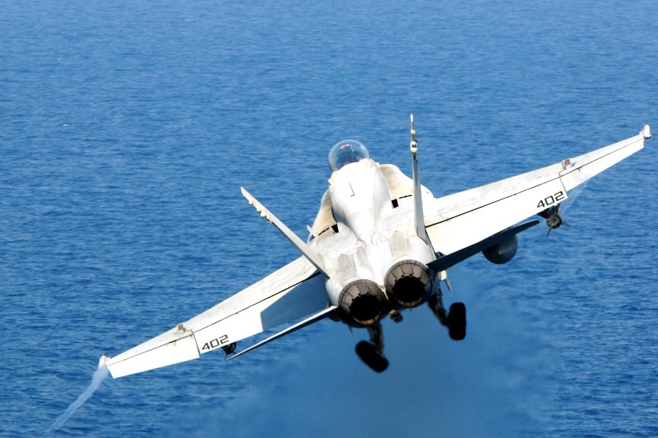 F-A-18C Hornet launches from USS George H.W. Bush 140922-N-CZ979-004